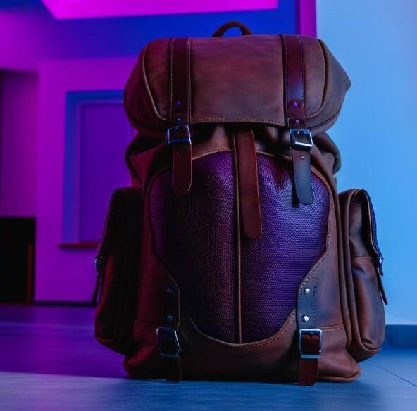 bag on back inside room lit with purple lights-1